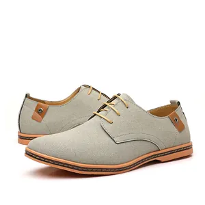 Classic grey suede men's casual Oxford shoes with stylish brown laces on white background