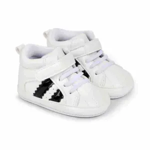 Side view detail of white baby high-top sneakers with purple laces and soft soles