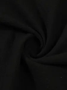 Detailed macro view of black cotton linen fabric texture with natural soft folds