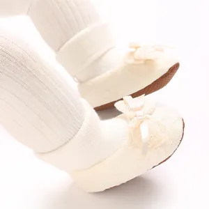 Soft cream baby socks shoes with delicate lace patterns and silk ribbon bows.