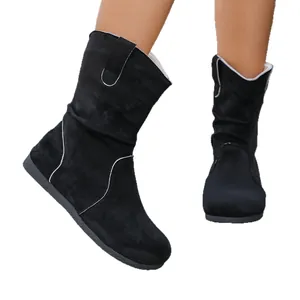 Women's black slouchy suede ankle boots with flat soles and comfortable slouch design