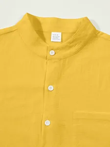 Close-up view of yellow linen cotton shirt showing mandarin collar and fabric texture