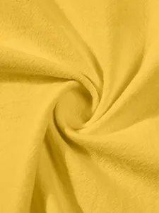Detailed macro shot showing the breathable texture of yellow cotton linen fabric for shirts