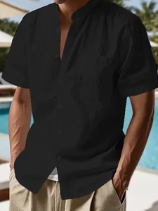 Close-up detail of a black men's short-sleeved shirt with a stylish stand collar
