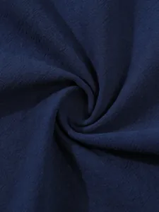 Close-up detail of high-quality dark blue cotton linen fabric texture