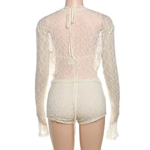 Detailed back view of a sexy white lace three-piece set featuring a hollow design.
