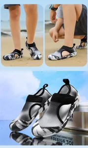 Close-up detail of breathable children's mesh wading shoes with marbled soles.