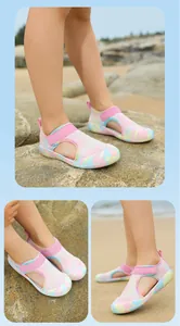 Breathable pink mesh children's wading shoes with colorful soles for beach play.