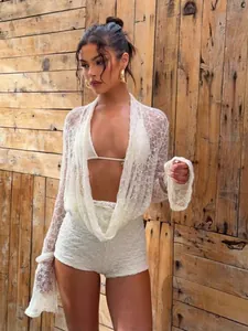 Sexy white lace three-piece set with long-sleeve shrug, halter top and shorts for women.