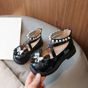 Elegant black patent leather girl's princess shoes with bowknot and pearl straps