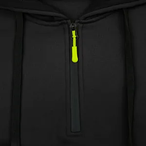 Close-up detail of a heavy weight black hoodie with a neon yellow zipper pull