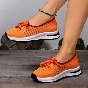 Breathable orange mesh slip-on sneakers for elderly women with non-slip soles