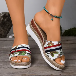 Elegant women's summer wedge sandals featuring floral embroidery and a comfortable platform sole