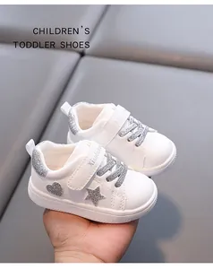 White microfiber toddler sneakers with silver star glitter and non-slip rubber sole