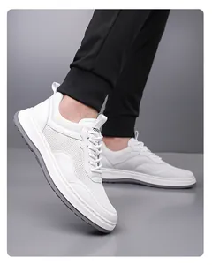 Close-up of men's white breathable fly-knit sneakers with grey non-slip soft sole