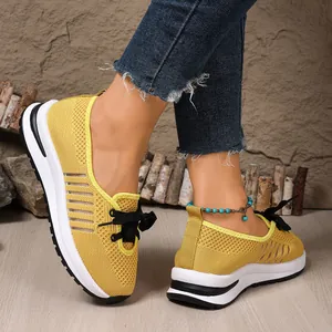 Detail showing the breathable yellow fly-woven mesh of these lightweight sneakers.