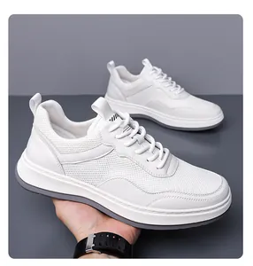 Detail view of white breathable mesh sneakers for men featuring lightweight soft soles