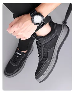 Close-up detail of breathable fly-knit mesh men's casual shoes with soft non-slip grey sole