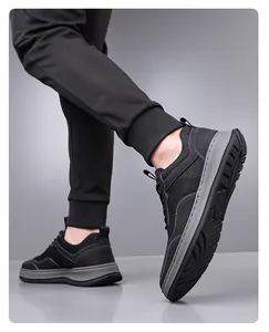 Detailed side view of black breathable flyknit sneakers for men with non-slip soft sole