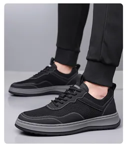 Detailed view of stylish black breathable mesh men's sneakers with soft non-slip gray sole