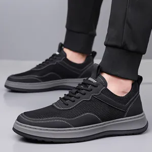 Breathable black men's fly-knit sneakers with flexible soft grey sole for spring