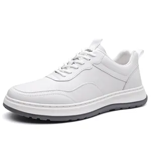 White minimalist men's leather sneaker with soft sole and grey outsole for spring 2026