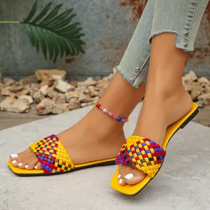 Vibrant multi-color woven flat sandals with a trendy square toe for street style.