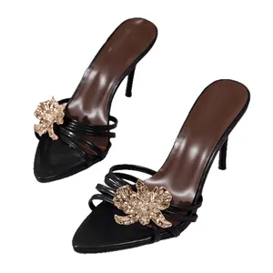 Elegant black pointed toe high heel mules with gold floral ornament decoration