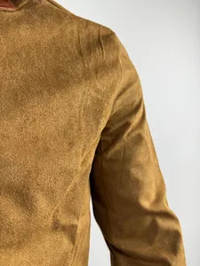 Detailed macro shot showing the premium brown suede-like texture of a men's vintage work jacket