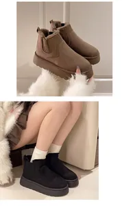 Detailed view of warm platform winter snow boots for women in brown and black colors