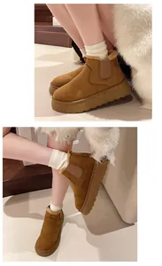 Detailed view of women's thick-soled brown snow boots with a warm plush lining