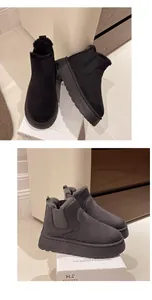Chic grey and black thick sole snow boots with warm fur lining and easy slip-on design