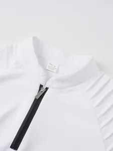 Detailed macro shot of white athletic sweatshirt collar featuring zipper and material label