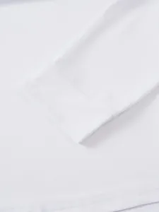 Macro view of white long-sleeve cuff detail showing fine stitching and soft fabric texture