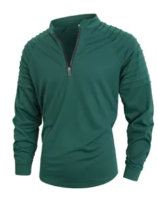 Close-up of men's dark green sports sweatshirt with ribbed shoulder detail and quarter zip