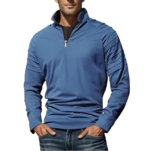 Detail of blue men's quarter-zip sports sweatshirt with pleated shoulder design