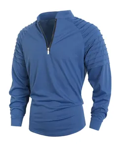 Detailed view of blue men's fitness top with pleated shoulder design and quarter-zip collar