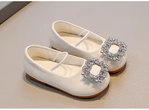 Elegant cream white baby girl flats featuring a sparkling crystal square buckle and soft sole
