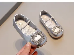 Elegant silver girls' Mary Jane flats featuring a sparkling rhinestone buckle detail
