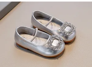 Elegant silver soft leather girls flat shoes with a sparkling crystal buckle detail
