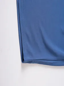 Close-up detail of blue sports sweatshirt fabric texture and durable double stitching