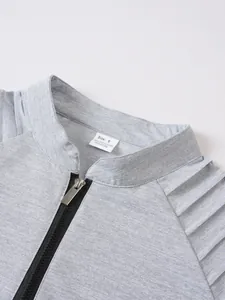 Detail view of grey men's sports sweatshirt showing stand-up collar, zipper, and size tag.