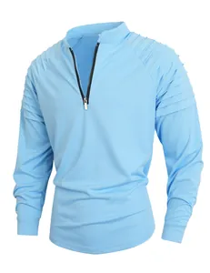 Detail of light blue men's sport T-shirt with quarter zip and pleated shoulder design