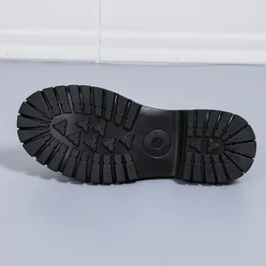 Detail view of the durable black lug sole of a platform loafer with size 37 mark