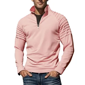 Detail view of men's pink quarter-zip sports sweatshirt with ribbed shoulder panels.