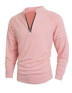Detailed view of pink men's athletic long sleeve shirt featuring a quarter-zip and pleated sleeves