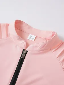 Close-up detail of pink men's sports sweatshirt collar with zipper and size label