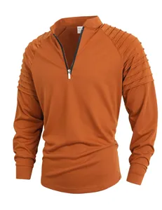 Close-up of burnt orange men's fitness sweatshirt featuring unique pleated shoulders