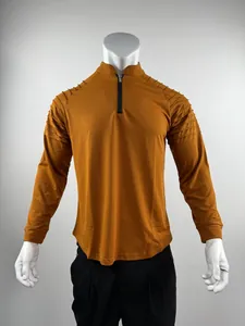 Men's mustard yellow quarter-zip athletic long sleeve shirt with ribbed shoulder detail