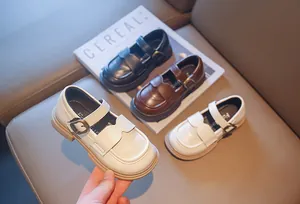 Selection of girls' British style Mary Jane leather shoes in beige brown and black